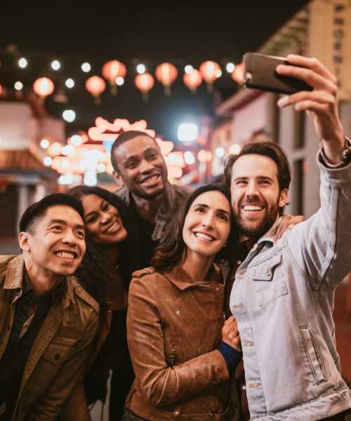 Friends taking a selfie outside near Sierra Glen in Modesto, California