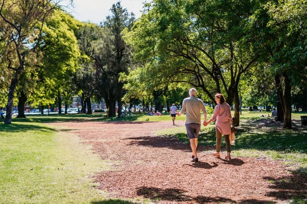 People walking through a park near Meadowbrook and Brookridge in Charlotte, North Carolina