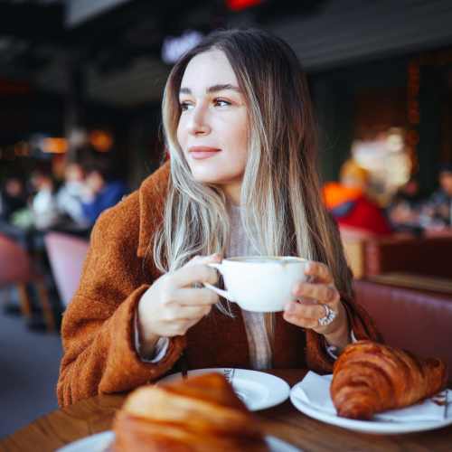 Resident enjoying a coffee at Eden Tower Apartments in Reno, Nevada