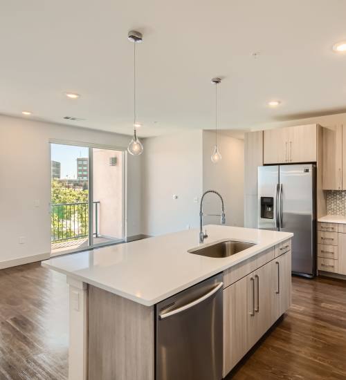 Kitchen island with sink at Station A Apartments in Denver, Colorado