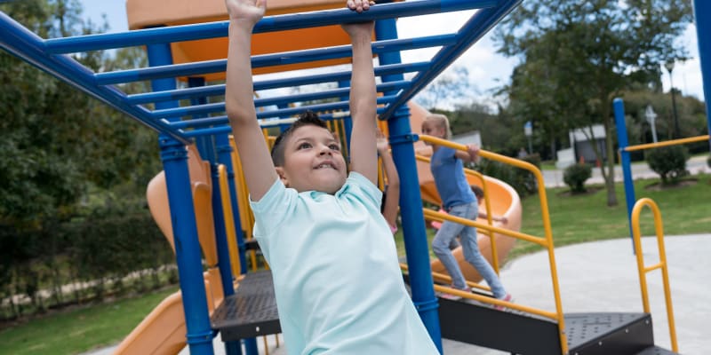 Children playing at a playground near Del Mar I in Oceanside, California