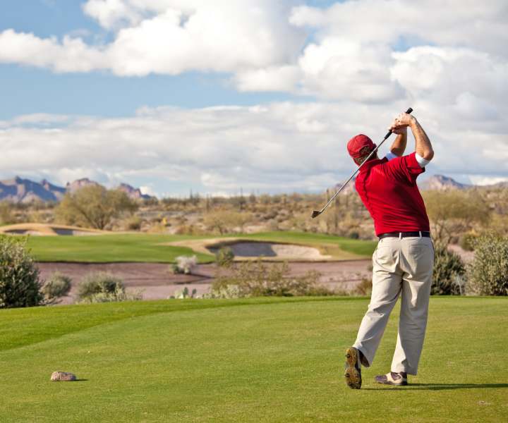 Resident man playing golf in a golf course near Kirman Garden in Reno, Nevada