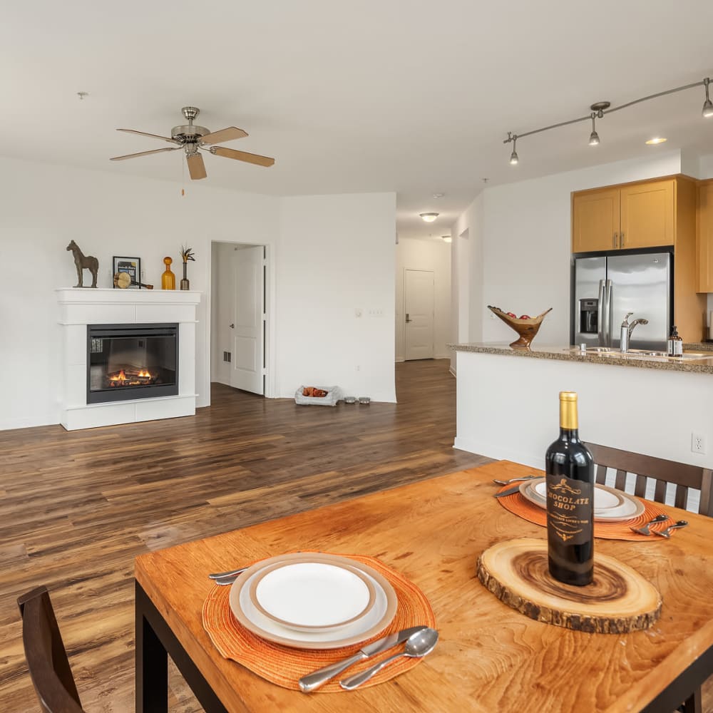 Dining area with fireplace in back at Chateau Woods in Woodinville, Washington