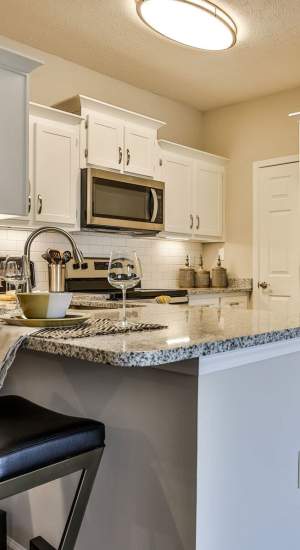 Kitchen with appliances at Avonlea Highlands in Cartersville, Georgia
