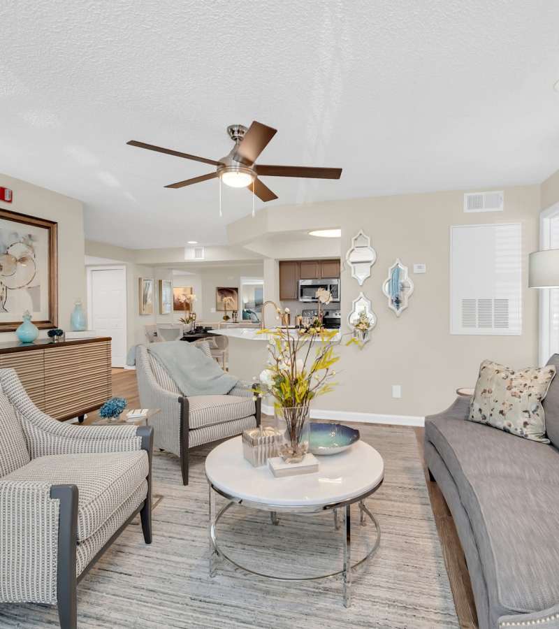 Living room with soft couch, sofa and coffee table at The Summit At Metrowest in Orlando, Florida