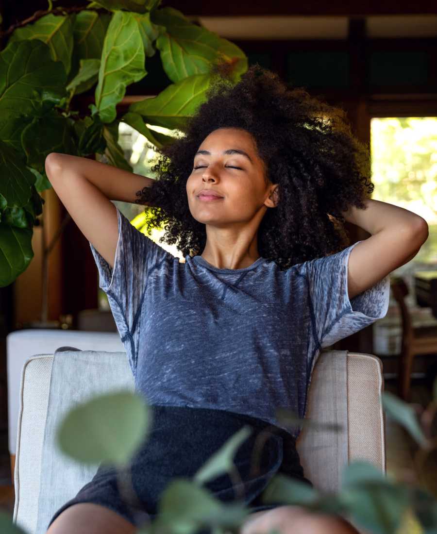 Woman relaxing at Big Sky Flats Apartments in Washington, District of Columbia