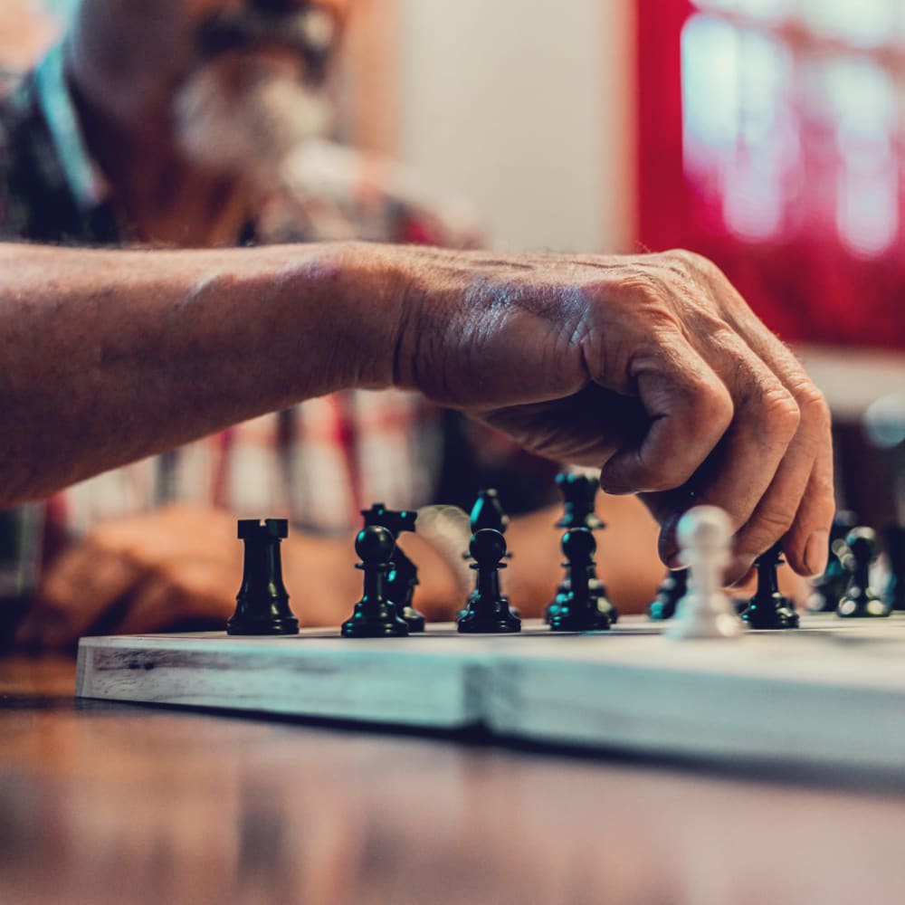 Residents playing chess at Garden Square at Westlake Assisted Living in Greeley, Colorado