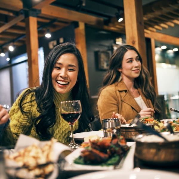 Friends having dinner at a favorite local spot near {location_name}} in Nashville, Tennessee