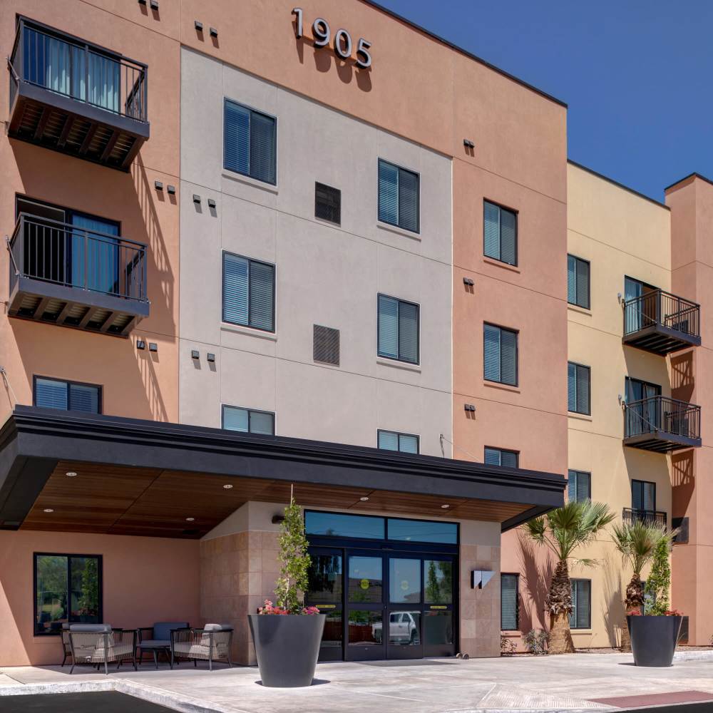 Multi-story apartment building with balconies and contemporary architecture at WaterWalk Phoenix - North Happy Valley in Phoenix, Arizona