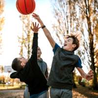 Kids playing with ball near Village at Carlsbad in Carlsbad, New Mexico
