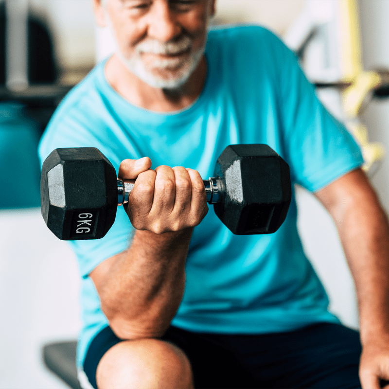 Resident lifting weights at The Views at Lake Havasu in Lake Havasu City, Arizona