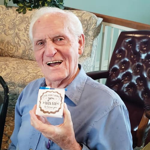 A resident holding a craft at Canoe Brook Assisted Living & Memory Care in Catoosa, Oklahoma