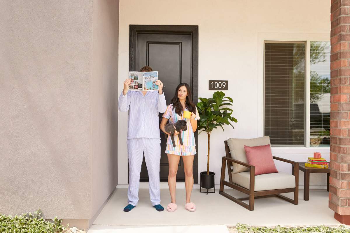Two residents and their dog on their front porch at BB Living Desert Ridge in Phoenix, Arizona