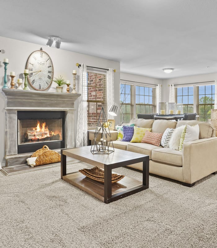 Spacious living room with large windows at Portofino Apartments in Wichita, Kansas