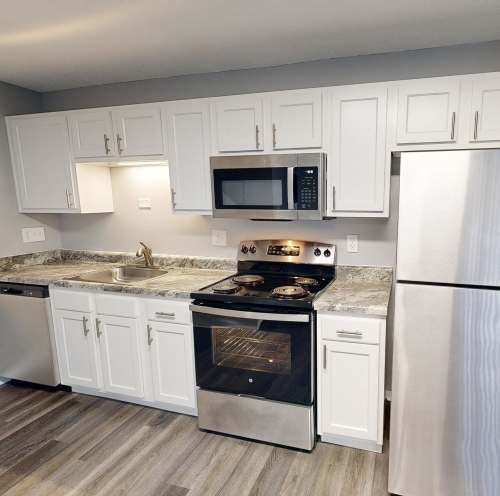 Kitchen with stainless steel appliances at Miamiview Apartments in Cleves, Ohio