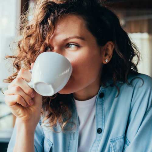 Resident having coffee at a cafe near District at 54 in Raleigh, North Carolina