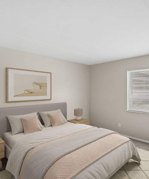 Cozy bedroom with natural light and modern decor accents at Granada Gardens Apartments in Warrensville Heights, Ohio