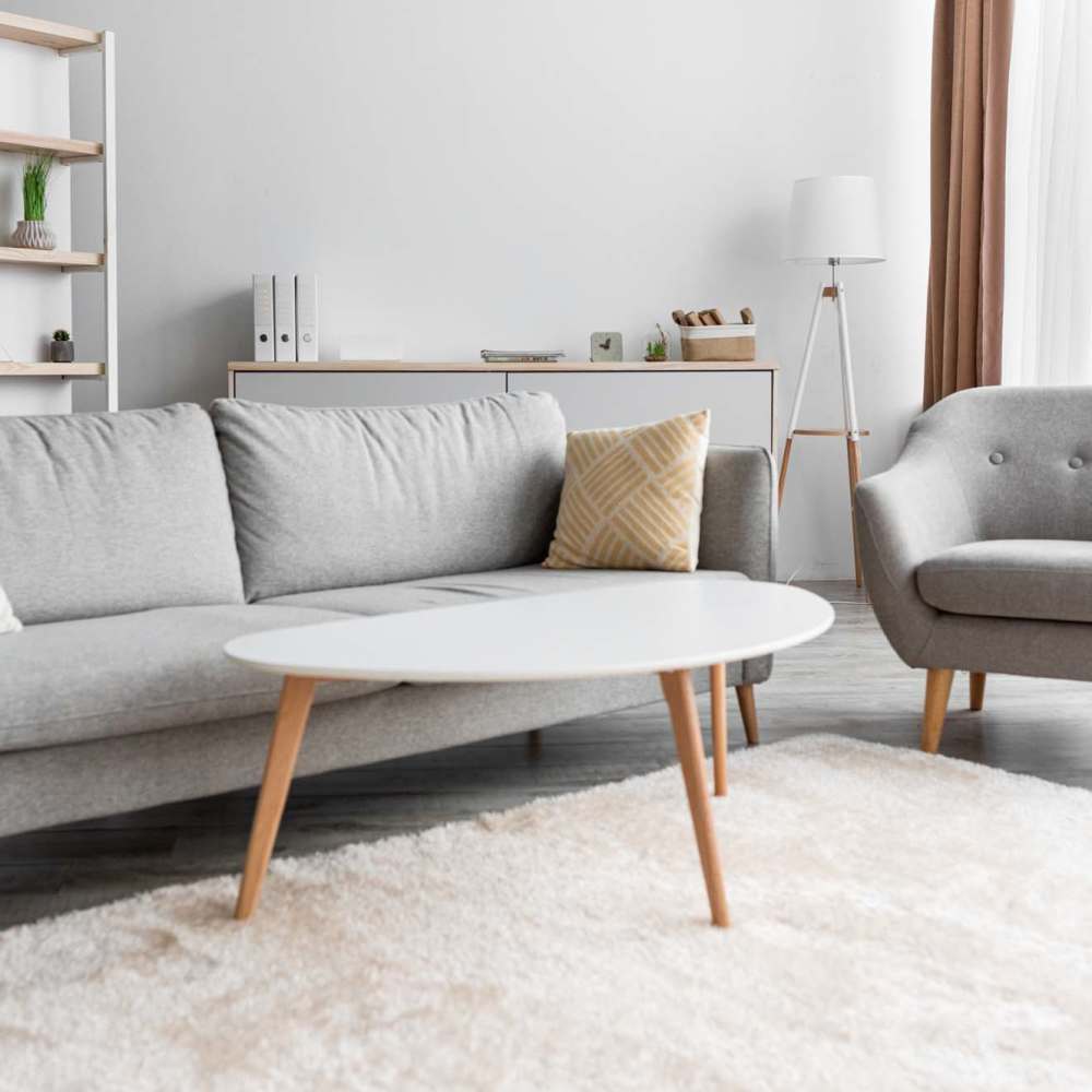 Specious living room with couch and center table at 570 Washington in New York, New York