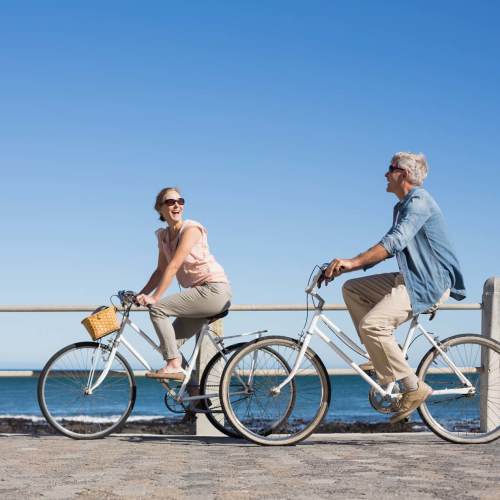 Residents cycling and having a good time near Bellflower Friendship Manor in Bellflower, California