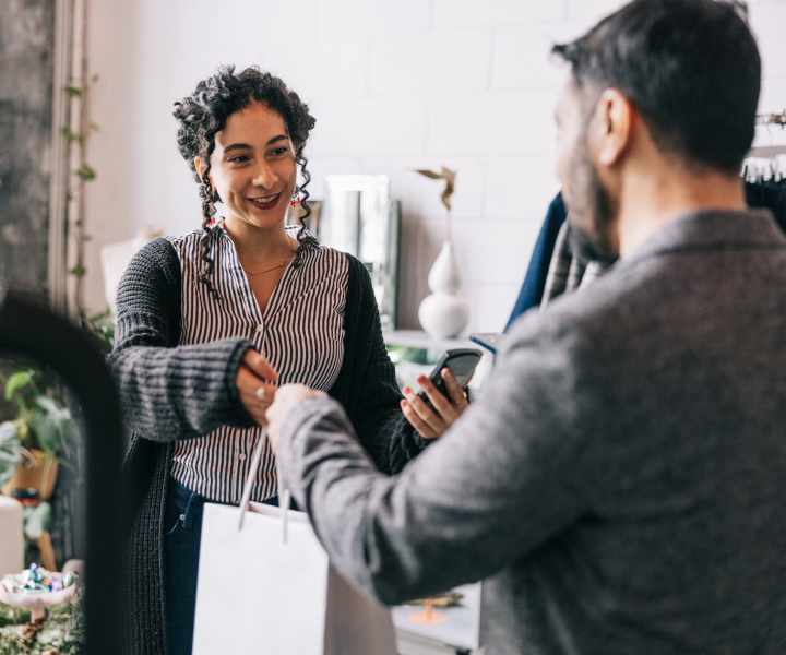 Resident shopping at a clothing boutique near Woodland Manor in Farmington, New York