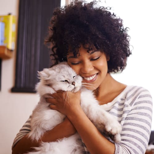 A resident holding a cat at Midway Manor in Virginia Beach, Virginia