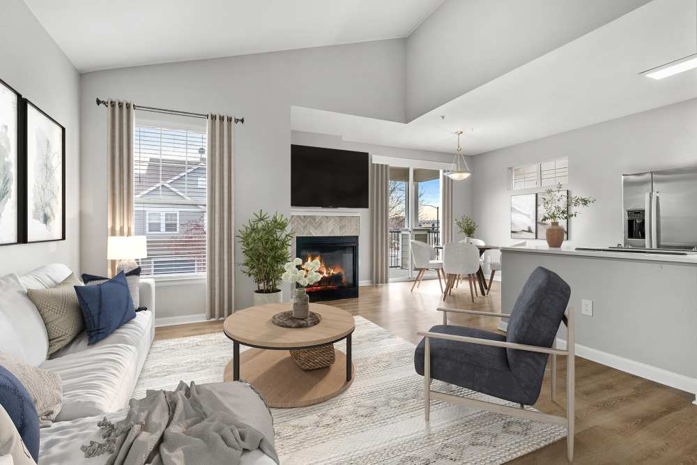 Newly Renovated Living Room With Hardwood Style Flooring and Fireplace at Briargate on Main in Parker, Colorado