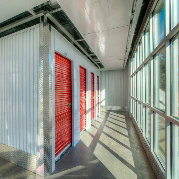 Red doors on indoor units at StorQuest Self Storage in Clearwater, Florida