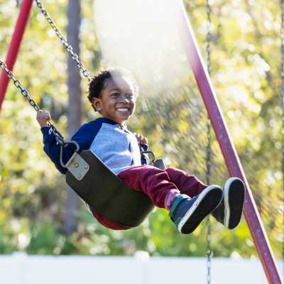 Kids swinging at a playground near The Madison in Charlotte, North Carolina