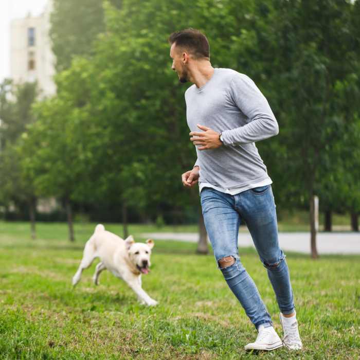 Resident dog runing in park at Council Crossing in Bethany, Oklahoma