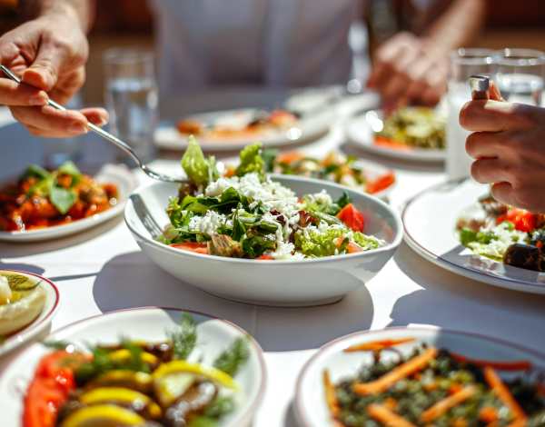Residents having lunch at restaurant near The Courtney at Lake Shadow in Orlando, Florida