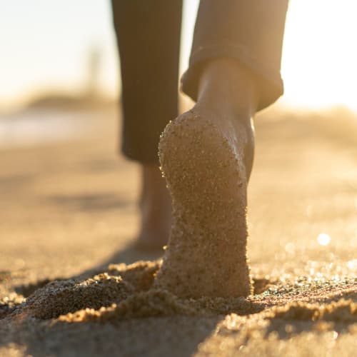 Sandy feet walking on the beach at Vesta Creeks Run in North Charleston, South Carolina