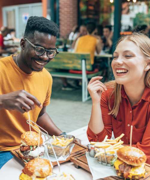 Resident couple having food at restaurant near LeSilve in Middleton, Wisconsin
