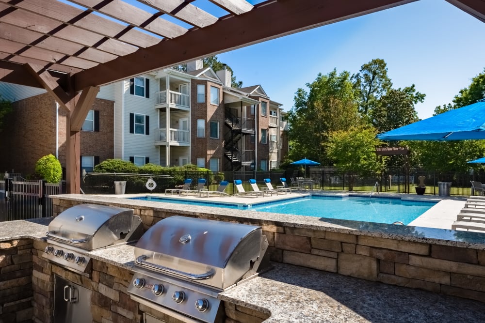 An outdoor grilling station near the community pool at Chace Lake Villas in Birmingham, Alabama