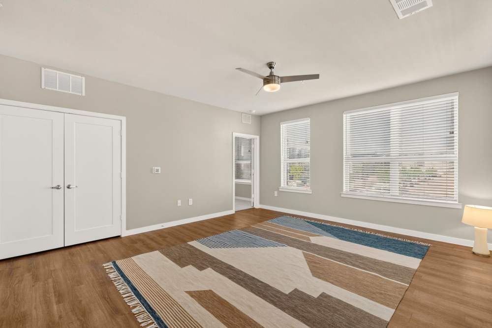 Living room with ceiling fan at The Springs at Georgetown in Georgetown, Texas