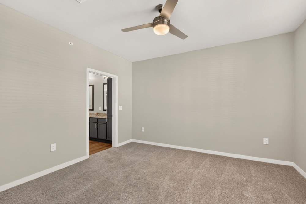 Bedroom with ceiling fan at The Springs at Georgetown in Georgetown, Texas
