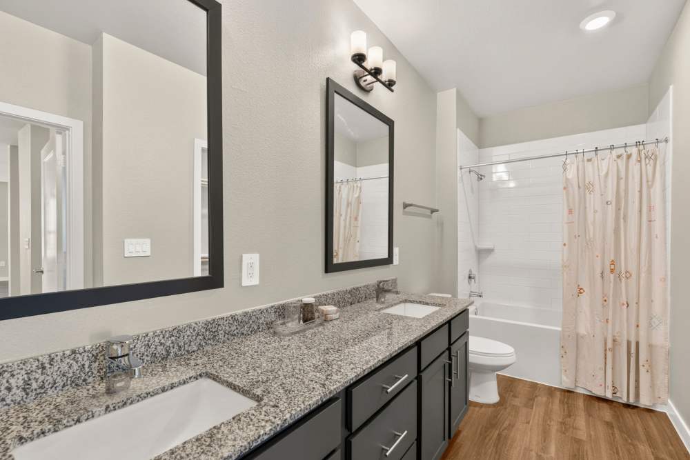 Bathroom with dual vanities at The Springs at Georgetown in Georgetown, Texas