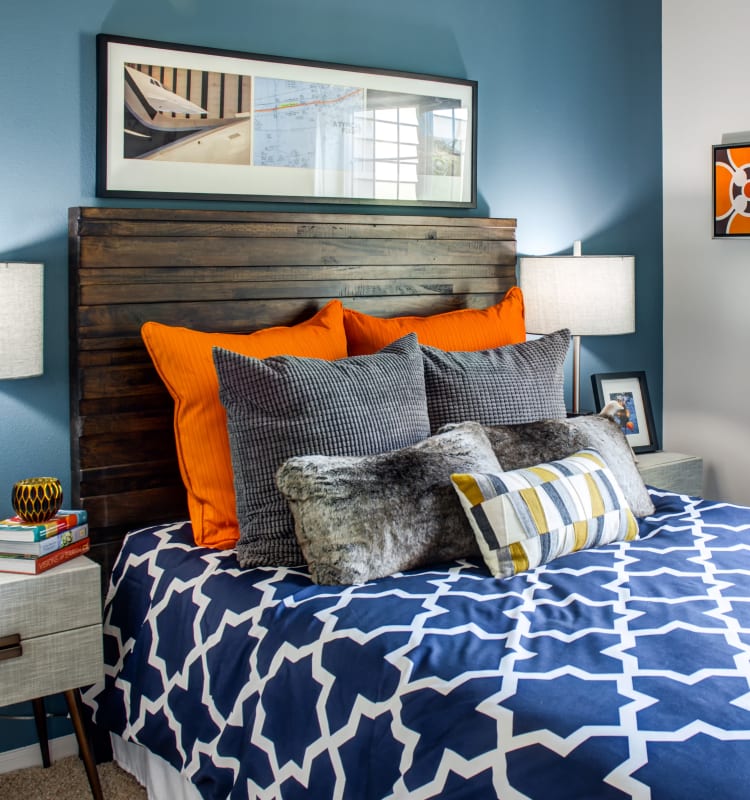 Colorfully decorated bedroom with an accent wall in a model home at Sofi at Cedar Mill in Portland, Oregon