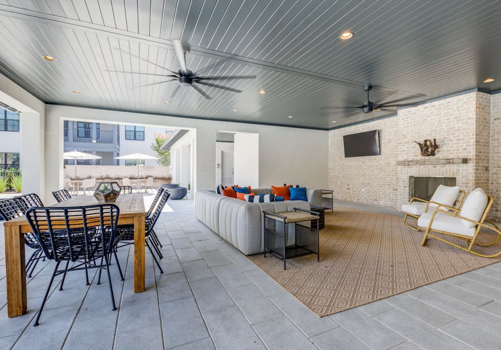 Outdoor lounge area with a fireplace at The Residences at 393 North in Santa Rosa Beach, Florida