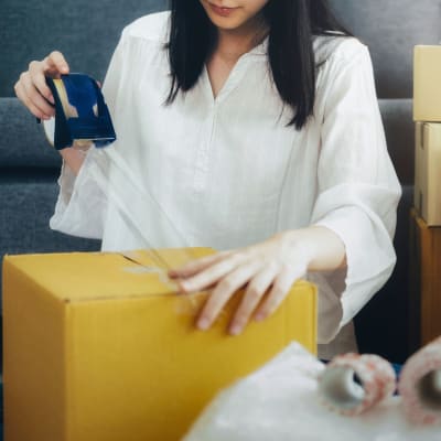 A customer taping a box at Storage Star - Rio Vista in Rio Vista, California