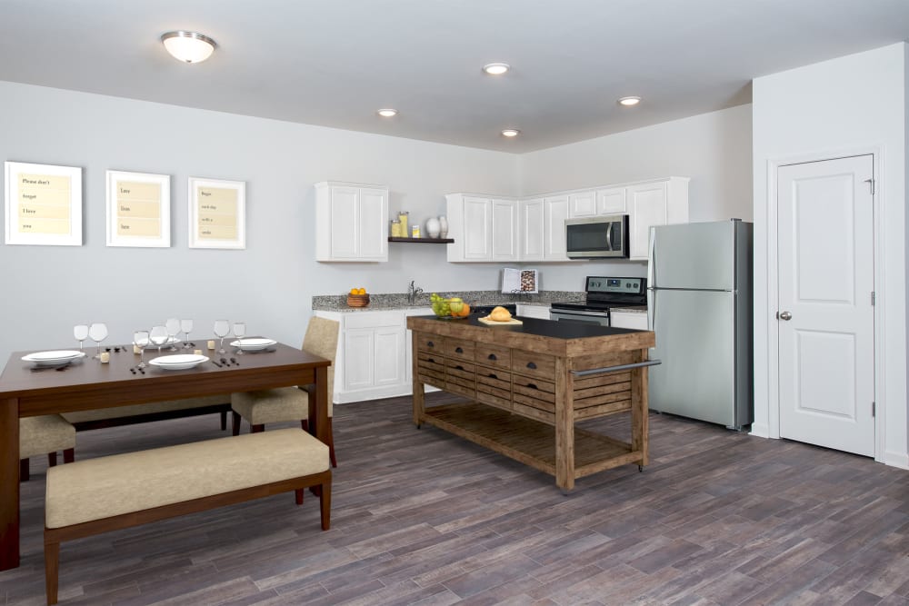 A rendering of an apartment living room and dining room at Artisan Living Bella Citta in Davenport, Florida