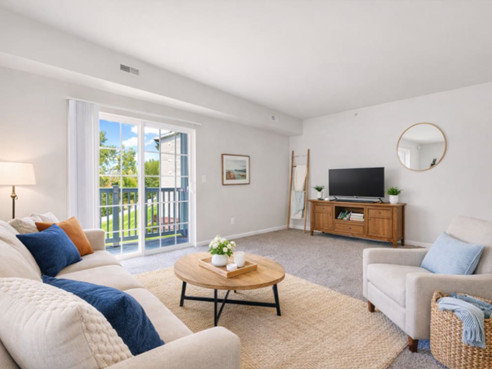 A spacious well furnished living room at The Haven at Grand Landing Apartments in Grand Haven, Michigan 
