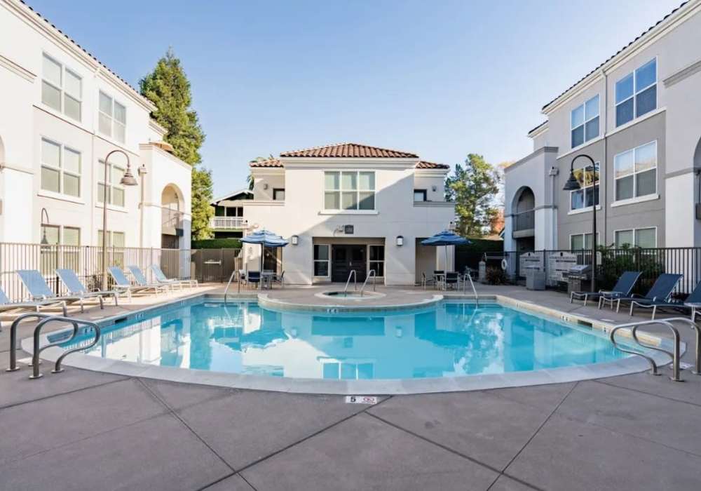 Swimming pool with lounge beds at Villa Montanaro in Pleasant Hill, California,