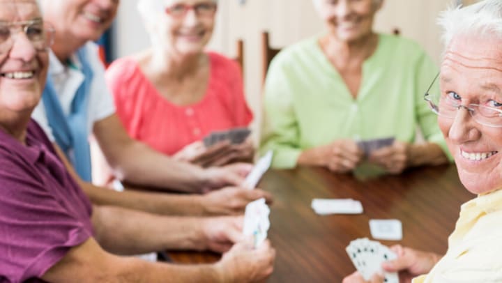 Group of seniors playing cards