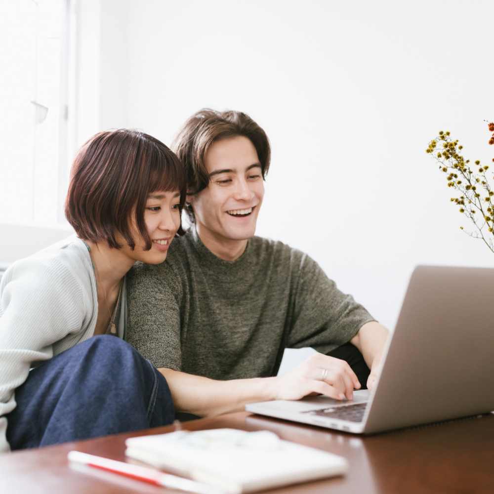 Resident couple using online payment portal at Central West End Apartments in Saint Louis, Missouri