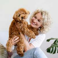 Resident holding her dog at Tapestry on Vaughn in Montgomery, Alabama,