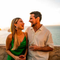 Couple enjoying drinks at sunset near Cape At Savona Apartments in Cape Coral, Florida