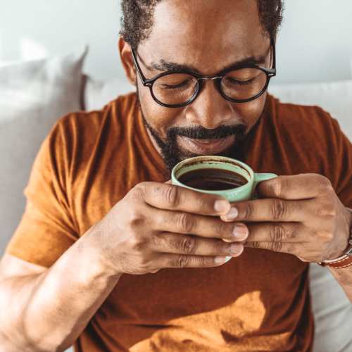 Resident having coffee at Villas At Camino Bernardo in San Diego, California