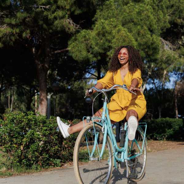 Resident riding bike happily near Cascade in Chicago, Illinois