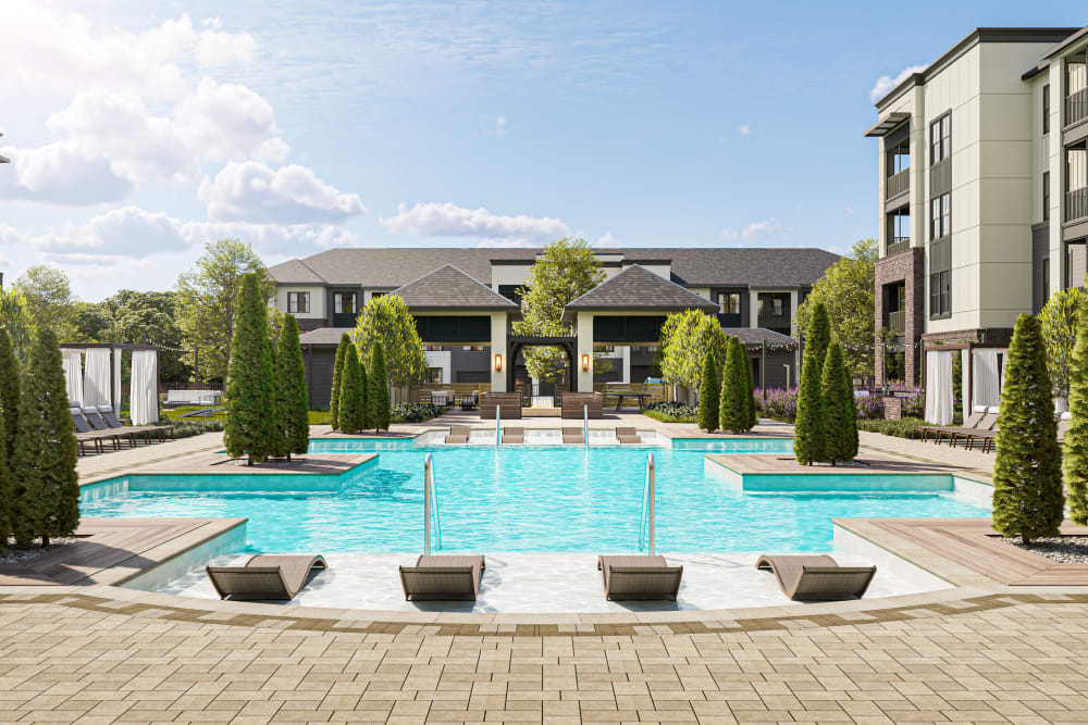 Pool with submerged sunbathing chairs at Westport Lofts in Belville, North Carolina