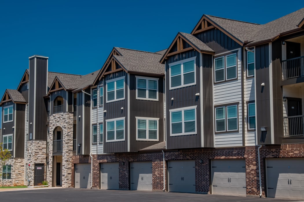 Beautiful building with attached garages at Stonehorse Crossing Apartments in Oklahoma City, Oklahoma